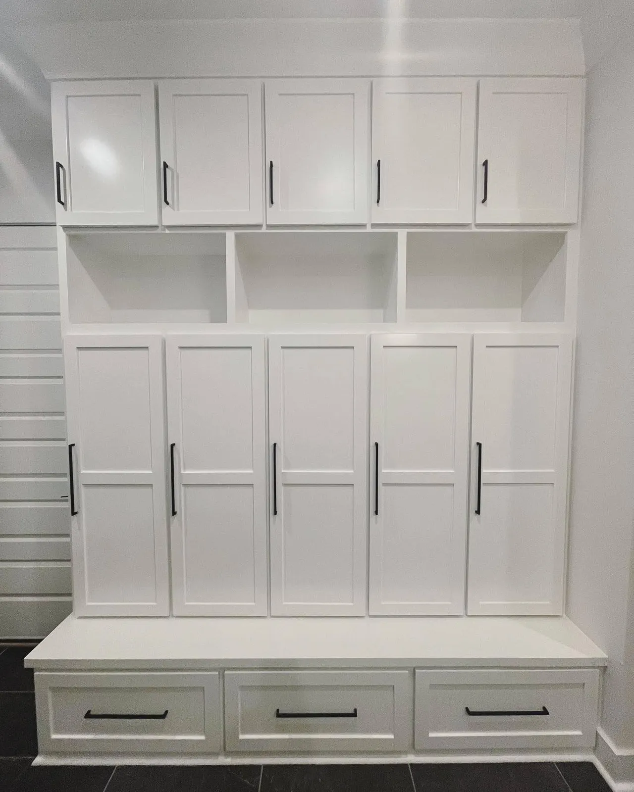 White modular bedroom storage with open shelves and closed cabinetry