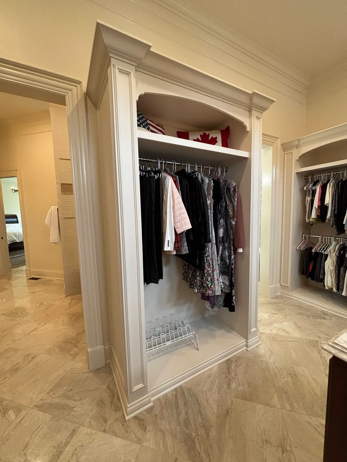 White walk-in closet system with double rod hanging and open shelving