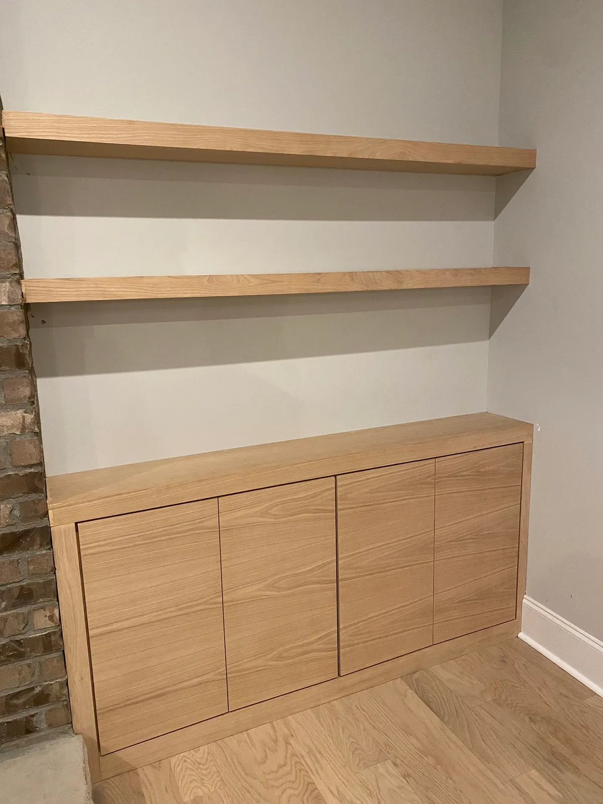 Wood floating shelves over walnut cabinet with open frame design